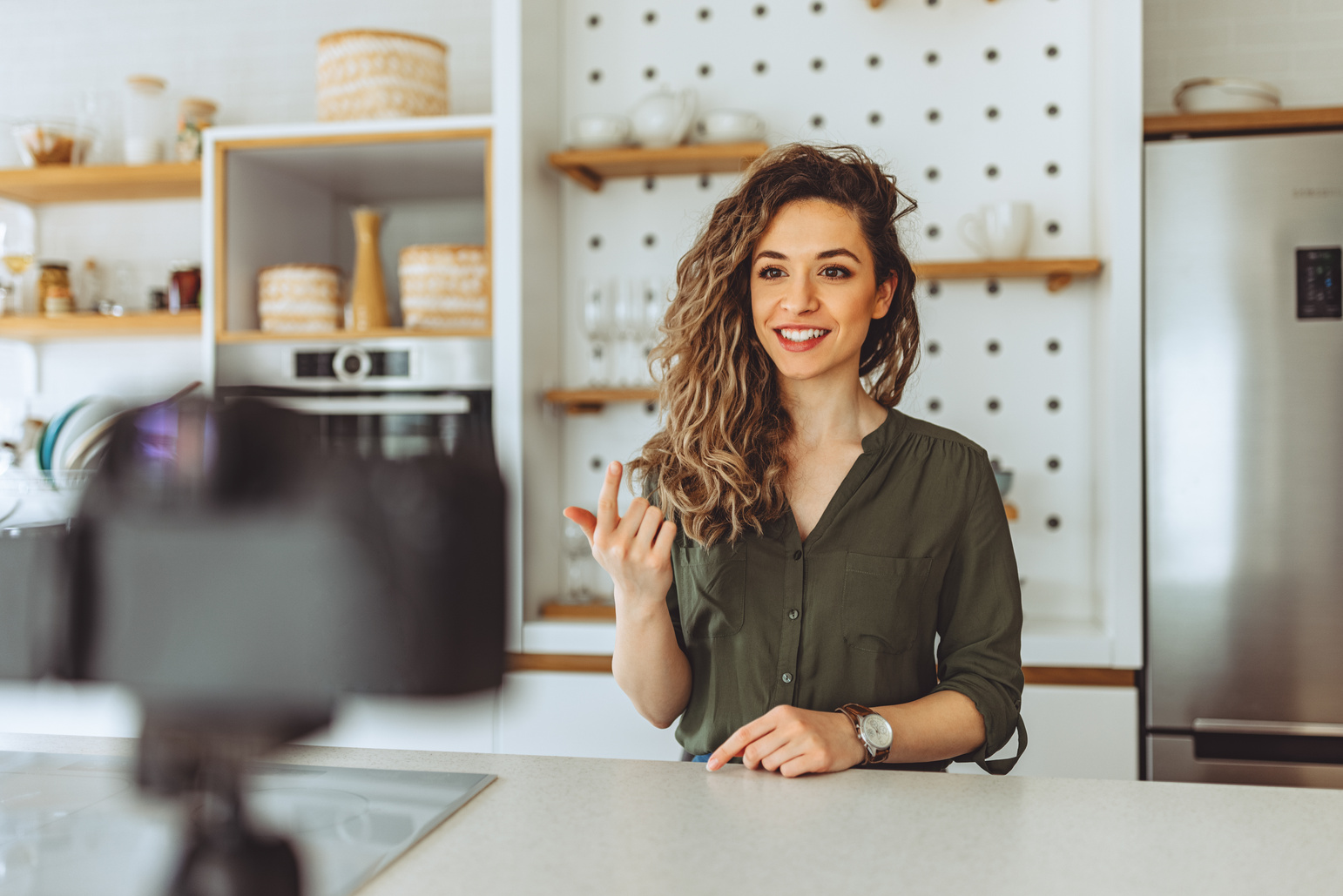 Social media influencer creating content at home.